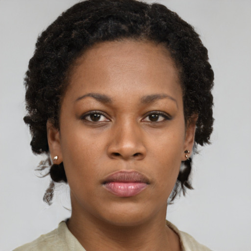 Neutral black young-adult female with short  brown hair and brown eyes