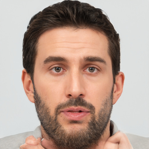 Neutral white young-adult male with short  brown hair and brown eyes