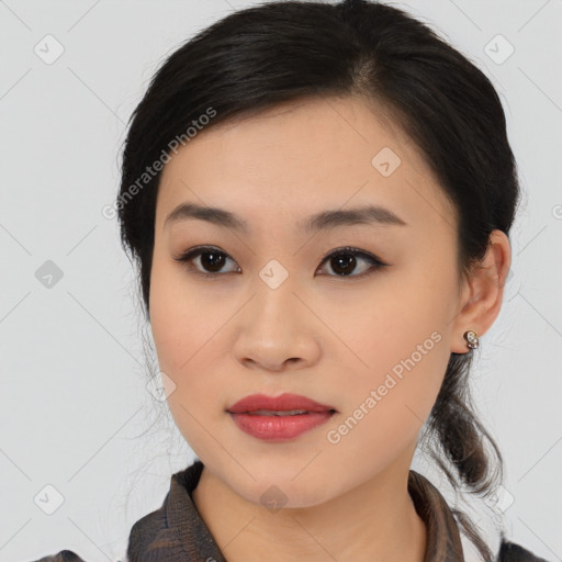 Joyful asian young-adult female with medium  black hair and brown eyes