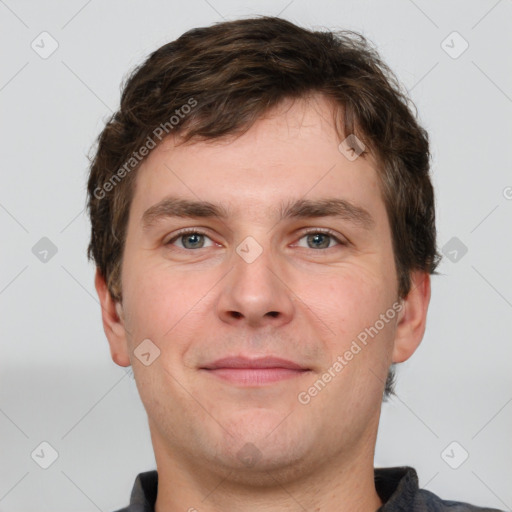 Joyful white adult male with short  brown hair and grey eyes