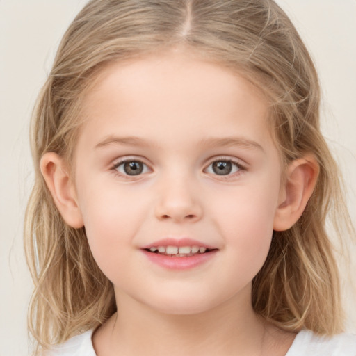 Joyful white child female with medium  brown hair and grey eyes