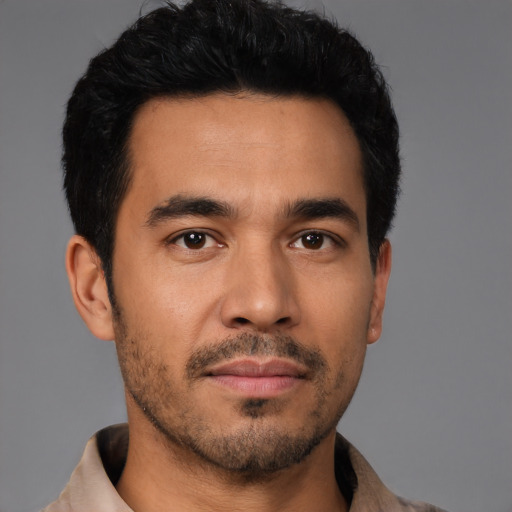 Neutral latino young-adult male with short  black hair and brown eyes