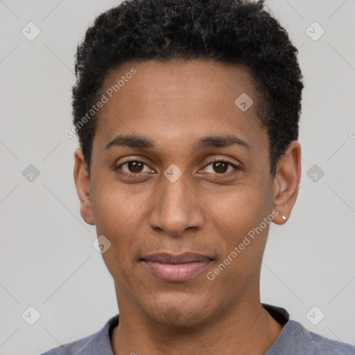 Joyful black young-adult male with short  black hair and brown eyes