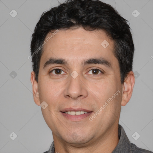 Joyful white adult male with short  black hair and brown eyes