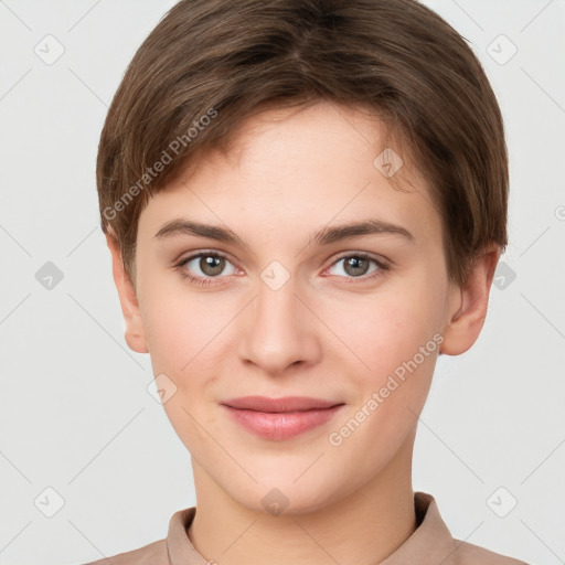 Joyful white young-adult female with short  brown hair and brown eyes