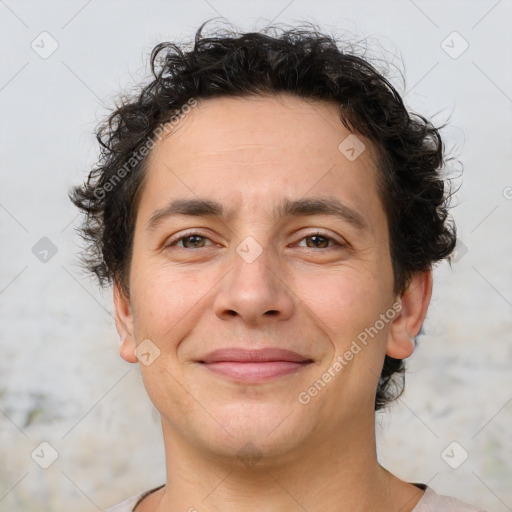 Joyful white adult male with short  brown hair and brown eyes