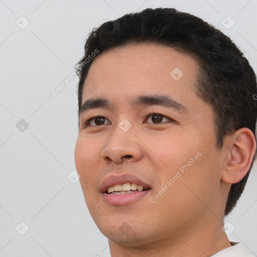 Joyful white young-adult male with short  black hair and brown eyes