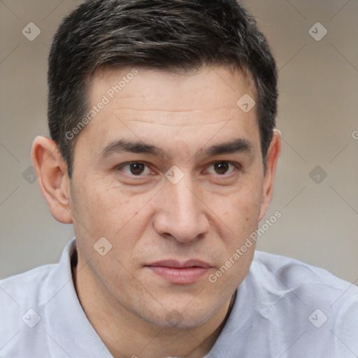 Joyful white adult male with short  brown hair and brown eyes