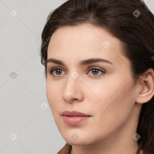 Neutral white young-adult female with long  brown hair and brown eyes