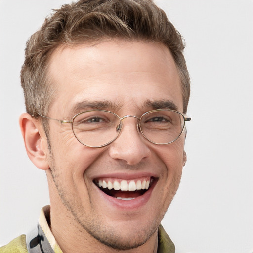 Joyful white adult male with short  brown hair and grey eyes