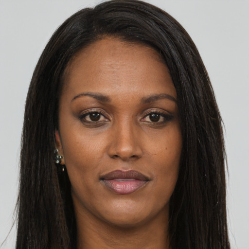 Joyful asian young-adult female with long  brown hair and brown eyes
