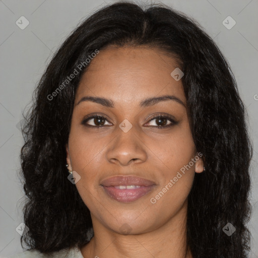 Joyful black young-adult female with long  brown hair and brown eyes