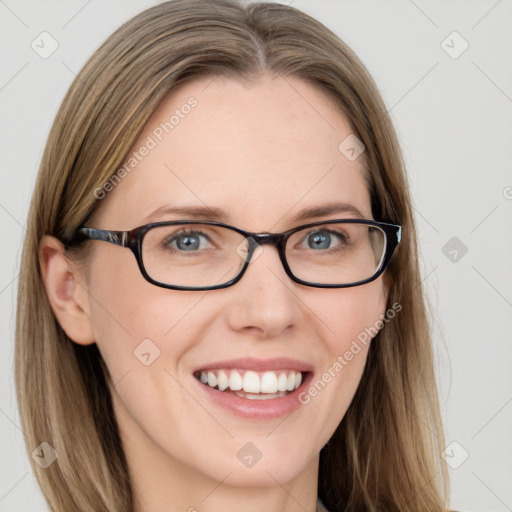 Joyful white young-adult female with long  brown hair and blue eyes