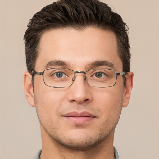 Joyful white adult male with short  brown hair and brown eyes