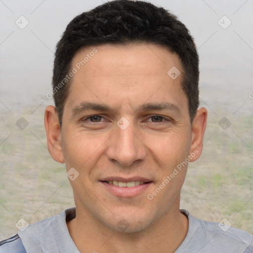 Joyful white adult male with short  brown hair and brown eyes