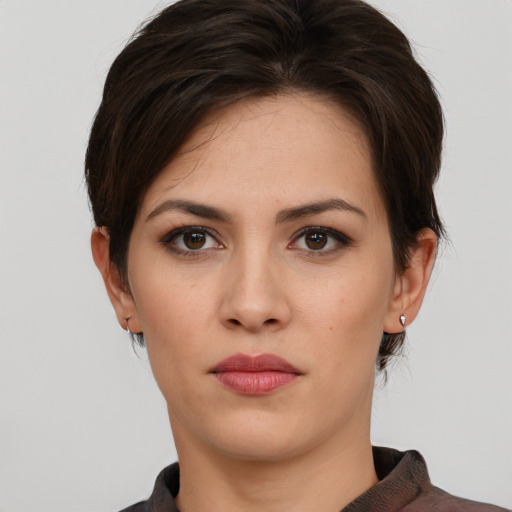 Neutral white young-adult female with short  brown hair and brown eyes