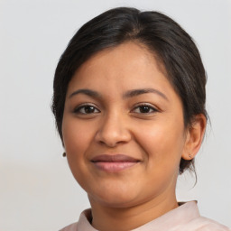 Joyful latino young-adult female with short  brown hair and brown eyes