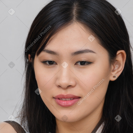 Joyful asian young-adult female with long  brown hair and brown eyes