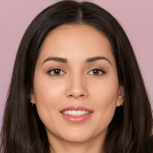 Joyful white young-adult female with long  black hair and brown eyes