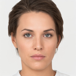 Neutral white young-adult female with short  brown hair and brown eyes