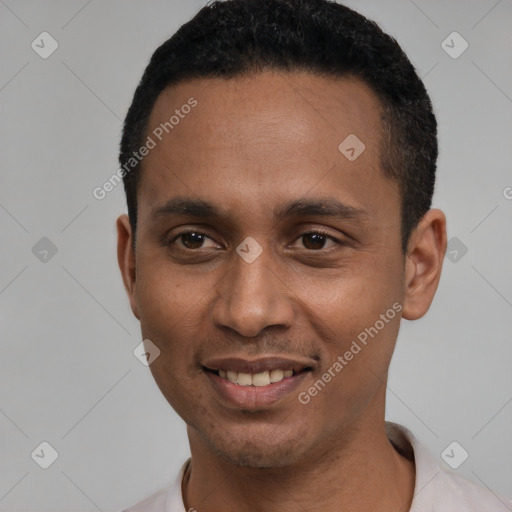 Joyful latino young-adult male with short  black hair and brown eyes