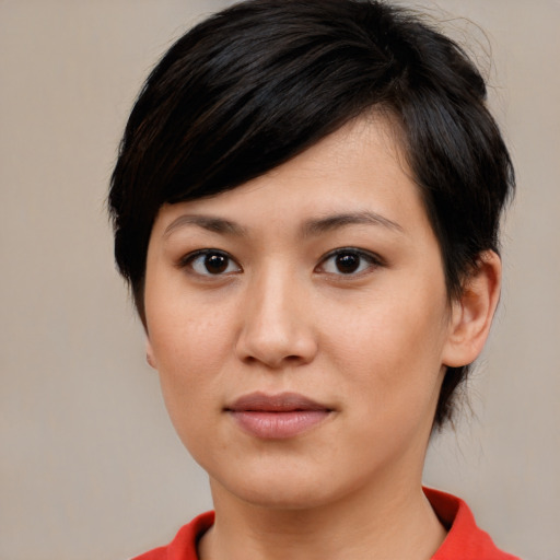 Joyful white young-adult female with medium  black hair and brown eyes