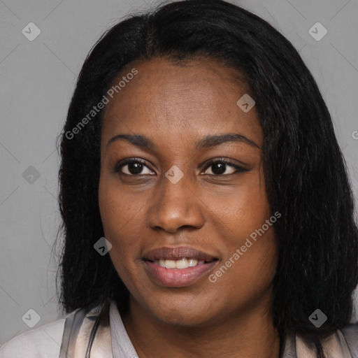 Joyful black young-adult female with long  black hair and brown eyes