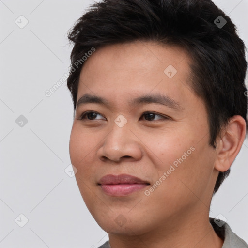 Joyful asian young-adult male with short  brown hair and brown eyes