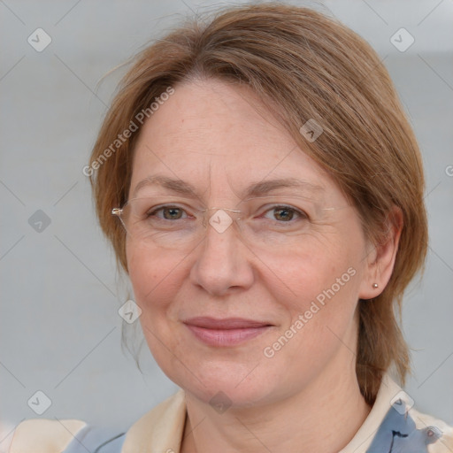 Joyful white adult female with medium  brown hair and blue eyes