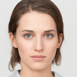 Neutral white young-adult female with medium  brown hair and grey eyes