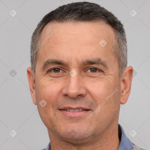 Joyful white adult male with short  brown hair and brown eyes