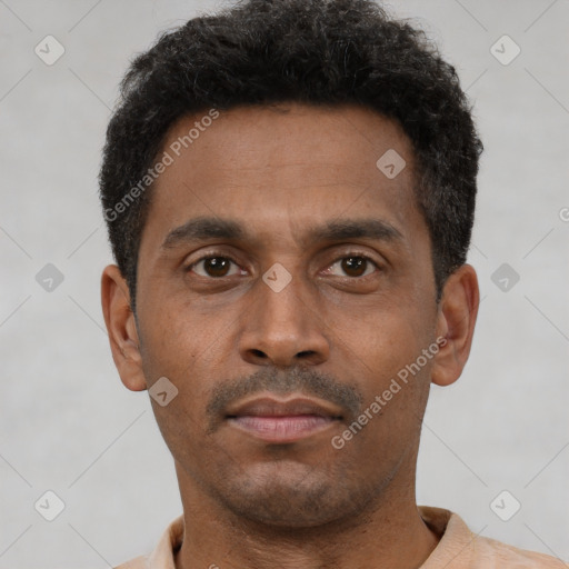 Neutral latino young-adult male with short  brown hair and brown eyes