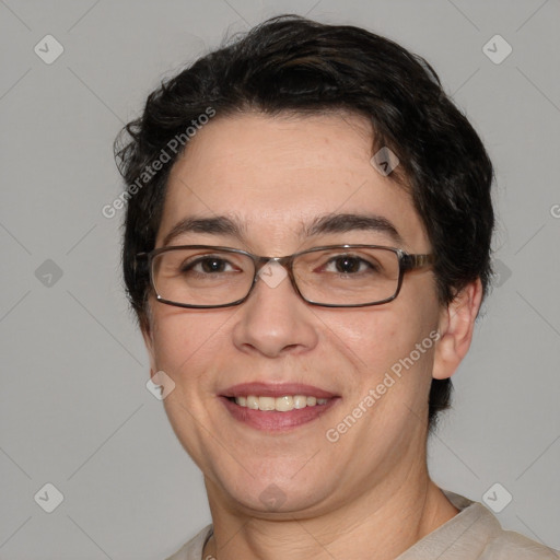 Joyful white adult male with short  black hair and brown eyes