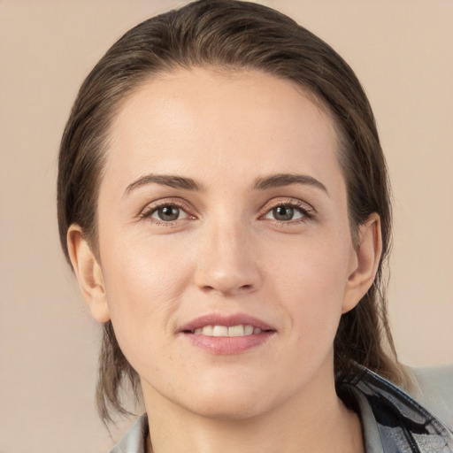 Joyful white young-adult female with medium  brown hair and brown eyes