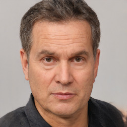 Neutral white middle-aged male with short  brown hair and brown eyes