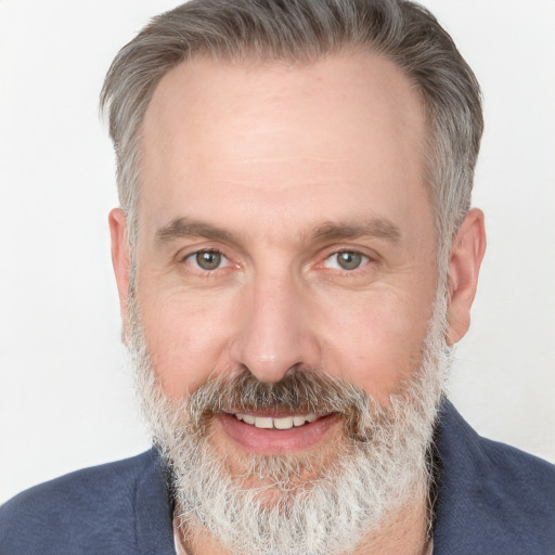 Joyful white adult male with short  brown hair and grey eyes