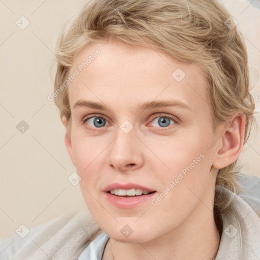 Joyful white young-adult female with medium  brown hair and blue eyes