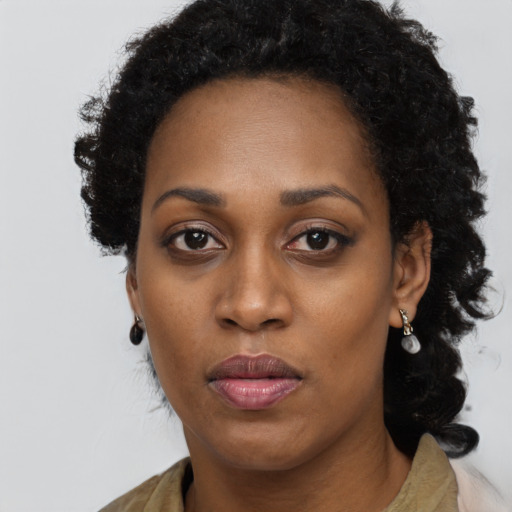 Neutral black young-adult female with long  black hair and brown eyes