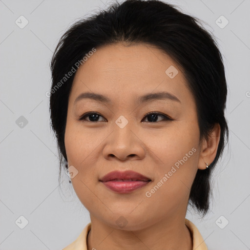 Joyful asian young-adult female with medium  brown hair and brown eyes