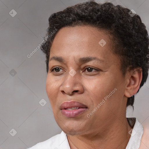 Joyful black adult female with short  brown hair and brown eyes