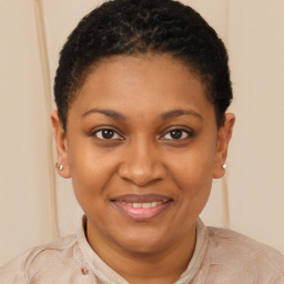 Joyful black young-adult female with short  brown hair and brown eyes