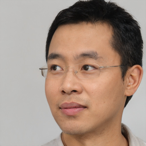 Neutral asian young-adult male with short  black hair and brown eyes