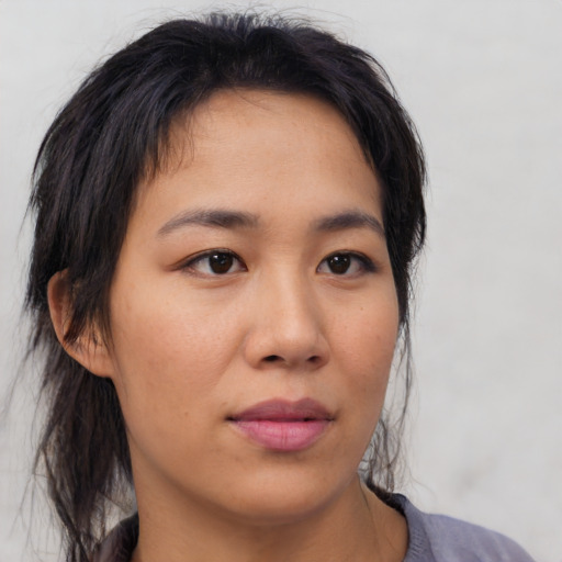 Neutral asian young-adult female with medium  brown hair and brown eyes