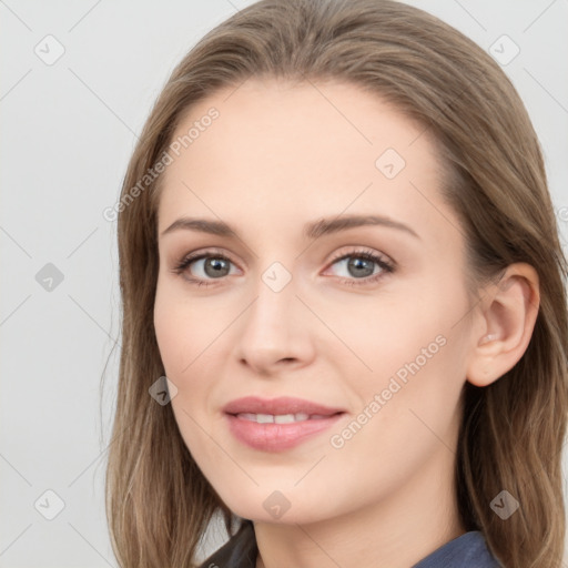 Joyful white young-adult female with long  brown hair and blue eyes