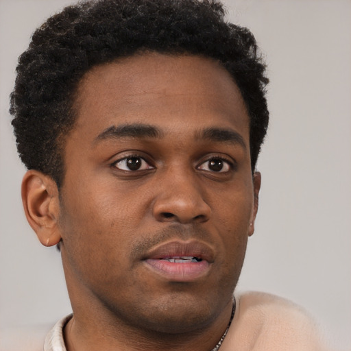 Neutral black young-adult male with short  brown hair and brown eyes