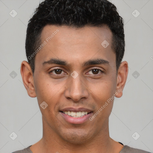 Joyful white young-adult male with short  black hair and brown eyes