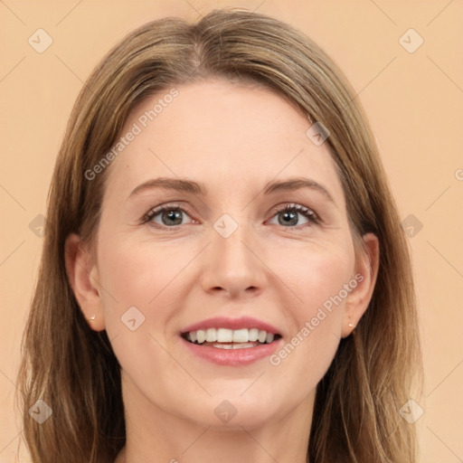 Joyful white adult female with long  brown hair and grey eyes