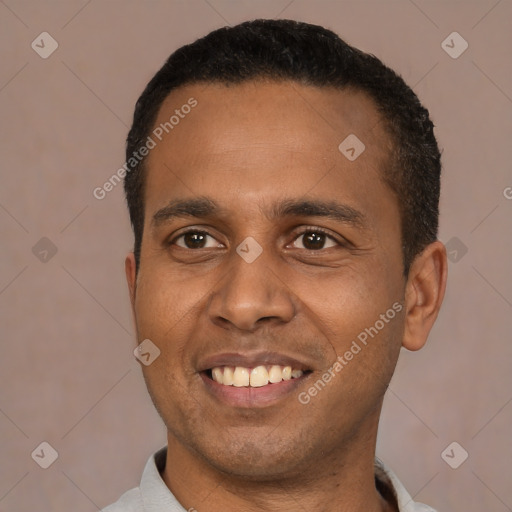 Joyful latino young-adult male with short  black hair and brown eyes