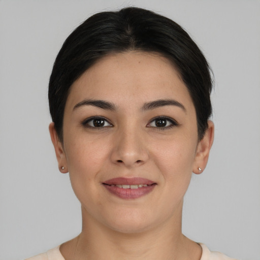 Joyful white young-adult female with short  black hair and brown eyes