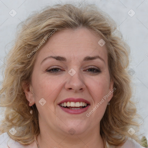 Joyful white adult female with medium  brown hair and blue eyes